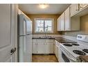 56-32 Whitnel Court Ne, Calgary, AB  - Indoor Photo Showing Kitchen With Double Sink 