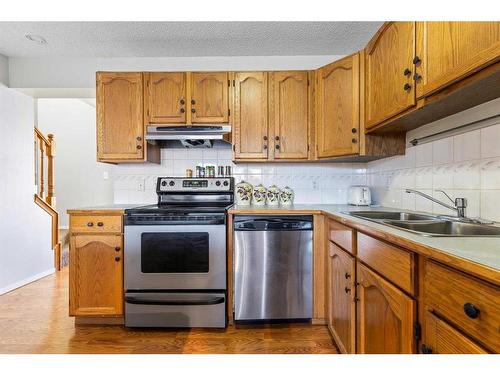 8 Coventry Lane Ne, Calgary, AB - Indoor Photo Showing Kitchen With Stainless Steel Kitchen With Double Sink