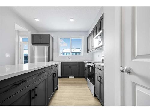 31 Legacy Passage Se, Calgary, AB - Indoor Photo Showing Kitchen With Upgraded Kitchen