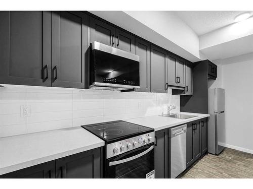 31 Legacy Passage Se, Calgary, AB - Indoor Photo Showing Kitchen With Upgraded Kitchen