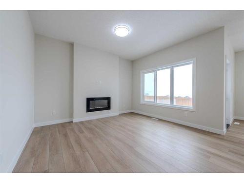 15 Waterford Street, Chestermere, AB - Indoor Photo Showing Living Room With Fireplace