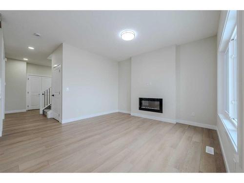 15 Waterford Street, Chestermere, AB - Indoor Photo Showing Other Room With Fireplace