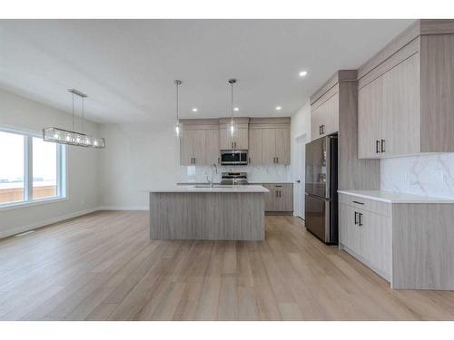 15 Waterford Street, Chestermere, AB - Indoor Photo Showing Kitchen With Upgraded Kitchen