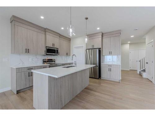 15 Waterford Street, Chestermere, AB - Indoor Photo Showing Kitchen With Upgraded Kitchen