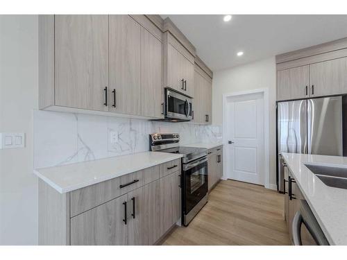 15 Waterford Street, Chestermere, AB - Indoor Photo Showing Kitchen With Upgraded Kitchen