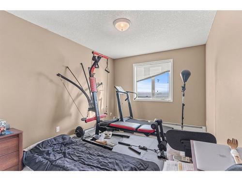 309-1010 Railway Street, Crossfield, AB - Indoor Photo Showing Gym Room