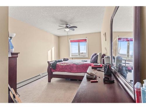 309-1010 Railway Street, Crossfield, AB - Indoor Photo Showing Bedroom