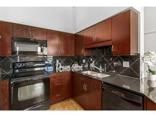 407-8880 Horton Road Sw, Calgary, AB - Indoor Photo Showing Kitchen With Double Sink