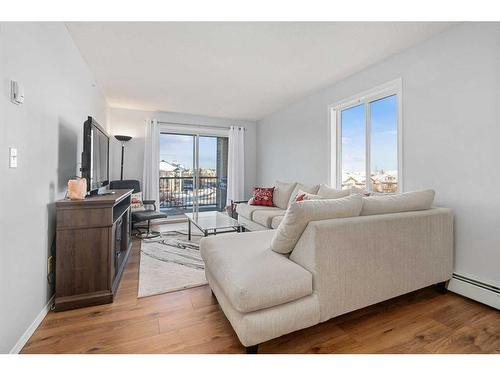 1350-2395 Eversyde Avenue Sw, Calgary, AB - Indoor Photo Showing Living Room