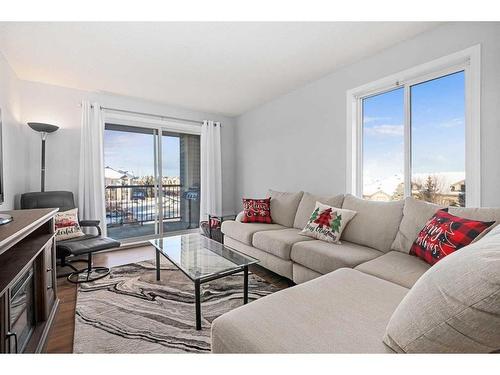 1350-2395 Eversyde Avenue Sw, Calgary, AB - Indoor Photo Showing Living Room