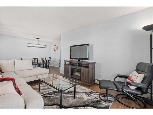 1350-2395 Eversyde Avenue Sw, Calgary, AB - Indoor Photo Showing Living Room