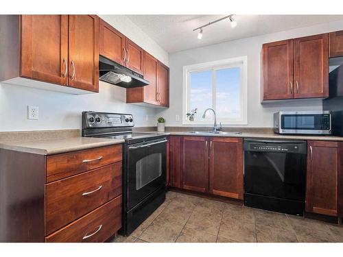 1350-2395 Eversyde Avenue Sw, Calgary, AB - Indoor Photo Showing Kitchen