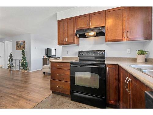 1350-2395 Eversyde Avenue Sw, Calgary, AB - Indoor Photo Showing Kitchen With Double Sink