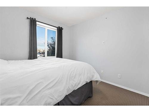 1350-2395 Eversyde Avenue Sw, Calgary, AB - Indoor Photo Showing Bedroom