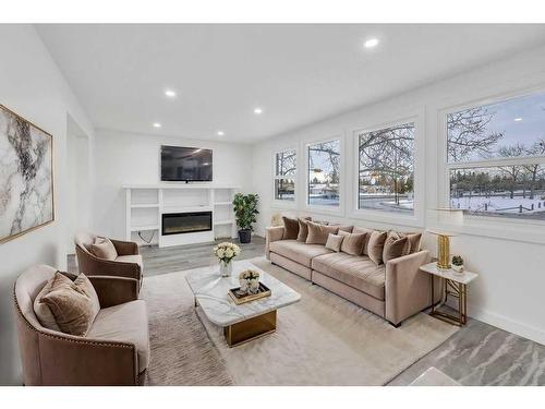 6644 Penbrooke Drive Se, Calgary, AB - Indoor Photo Showing Living Room With Fireplace