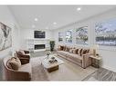 6644 Penbrooke Drive Se, Calgary, AB  - Indoor Photo Showing Living Room With Fireplace 