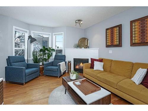 27 Mcdougall Court Ne, Calgary, AB - Indoor Photo Showing Living Room With Fireplace