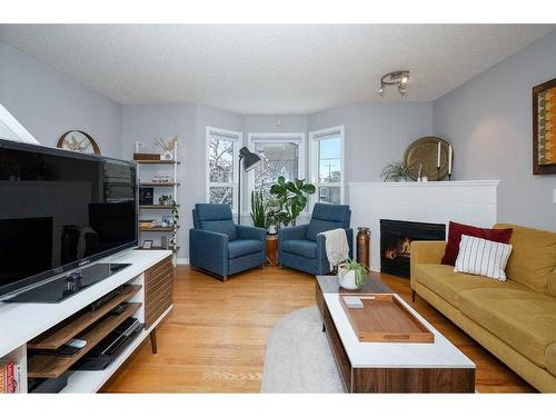 27 Mcdougall Court Ne, Calgary, AB - Indoor Photo Showing Living Room With Fireplace