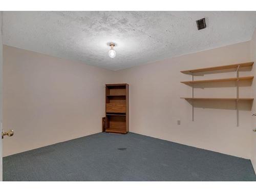 27-26 Quigley Drive, Cochrane, AB - Indoor Photo Showing Other Room