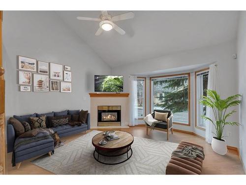 27-26 Quigley Drive, Cochrane, AB - Indoor Photo Showing Living Room With Fireplace