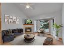 27-26 Quigley Drive, Cochrane, AB  - Indoor Photo Showing Living Room With Fireplace 