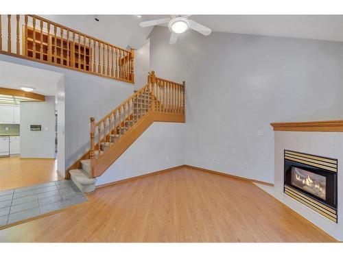 27-26 Quigley Drive, Cochrane, AB - Indoor With Fireplace