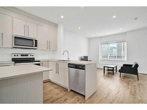 209-669 Savanna Blvd, Calgary, AB - Indoor Photo Showing Kitchen With Stainless Steel Kitchen With Upgraded Kitchen