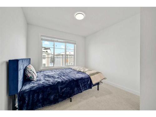 209-669 Savanna Blvd, Calgary, AB - Indoor Photo Showing Bedroom