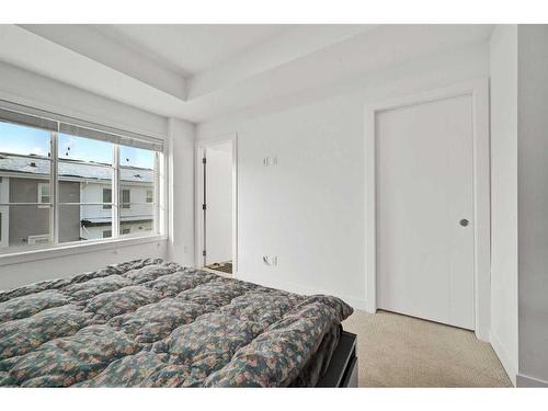 209-669 Savanna Blvd, Calgary, AB - Indoor Photo Showing Bedroom