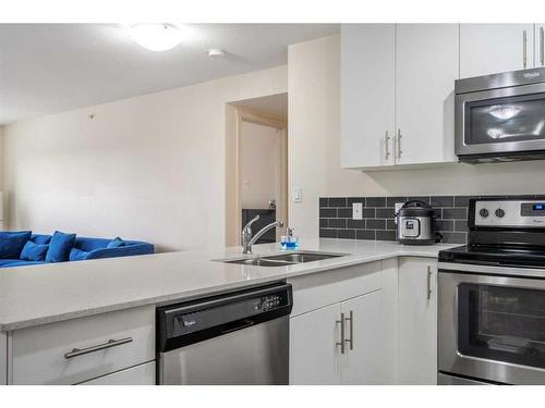 1416-181 Skyview Ranch Manor Ne, Calgary, AB - Indoor Photo Showing Kitchen With Stainless Steel Kitchen With Double Sink