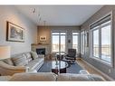 403-4 Hemlock Crescent Sw, Calgary, AB  - Indoor Photo Showing Living Room With Fireplace 