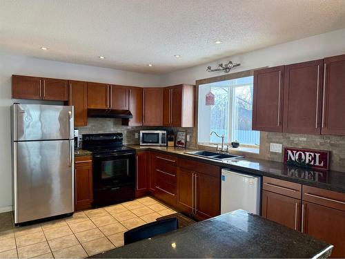 11305 85 Street Se, Calgary, AB - Indoor Photo Showing Kitchen With Double Sink