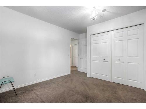 9-5790 Patina Drive Sw, Calgary, AB - Indoor Photo Showing Other Room