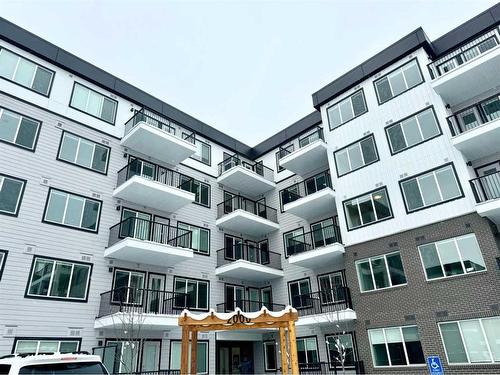 2101-111 Wolf Creek Drive Se, Calgary, AB - Outdoor With Balcony With Facade