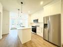 2101-111 Wolf Creek Drive Se, Calgary, AB  - Indoor Photo Showing Kitchen With Stainless Steel Kitchen With Upgraded Kitchen 