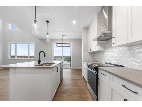 3042 Key Drive, Airdrie, AB - Indoor Photo Showing Kitchen With Double Sink With Upgraded Kitchen