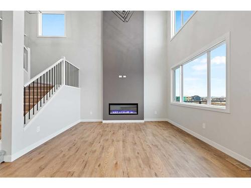 3042 Key Drive, Airdrie, AB - Indoor With Fireplace