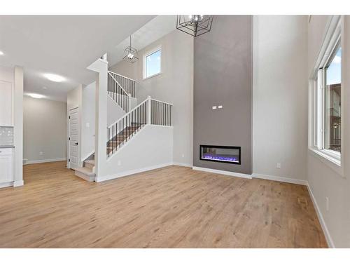 3042 Key Drive, Airdrie, AB - Indoor Photo Showing Other Room With Fireplace