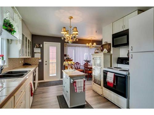 45 Elma Street West, Okotoks, AB - Indoor Photo Showing Kitchen With Double Sink