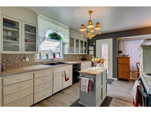 45 Elma Street West, Okotoks, AB - Indoor Photo Showing Kitchen With Double Sink