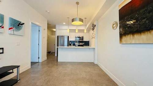 409-19621 40 Street, Calgary, AB - Indoor Photo Showing Kitchen