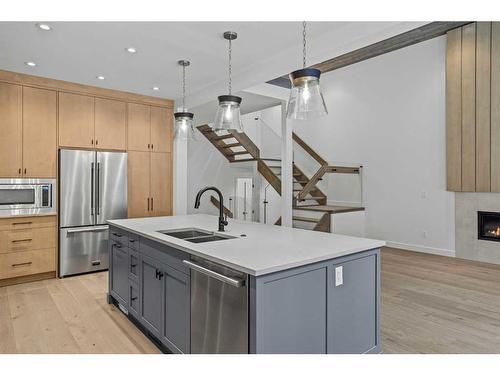 251A Three Sisters Drive, Canmore, AB - Indoor Photo Showing Kitchen With Double Sink With Upgraded Kitchen