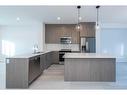 305-280 Chelsea Road, Chestermere, AB  - Indoor Photo Showing Kitchen With Stainless Steel Kitchen With Upgraded Kitchen 