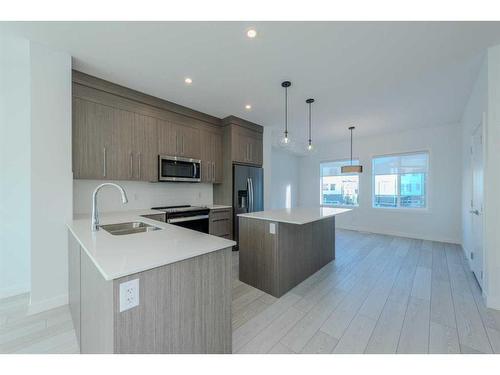 305-280 Chelsea Road, Chestermere, AB - Indoor Photo Showing Kitchen With Stainless Steel Kitchen With Double Sink With Upgraded Kitchen