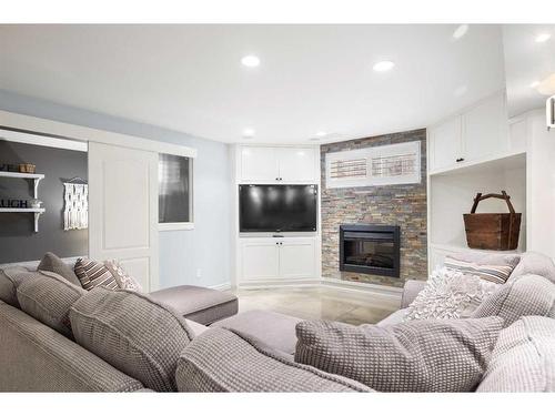 37 Wentworth Way Sw, Calgary, AB - Indoor Photo Showing Living Room With Fireplace