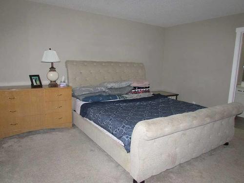 135 4 Avenue Se, High River, AB - Indoor Photo Showing Bedroom