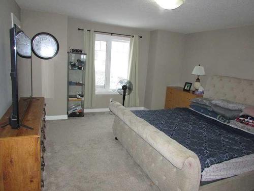 135 4 Avenue Se, High River, AB - Indoor Photo Showing Bedroom