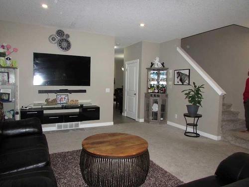 135 4 Avenue Se, High River, AB - Indoor With Fireplace