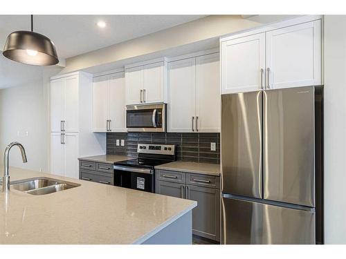 460 Sora Boulevard Se, Calgary, AB - Indoor Photo Showing Kitchen With Double Sink With Upgraded Kitchen