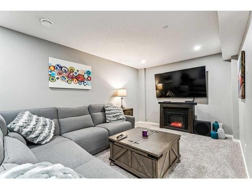 58 Livingston Gate Ne, Calgary, AB - Indoor Photo Showing Living Room With Fireplace